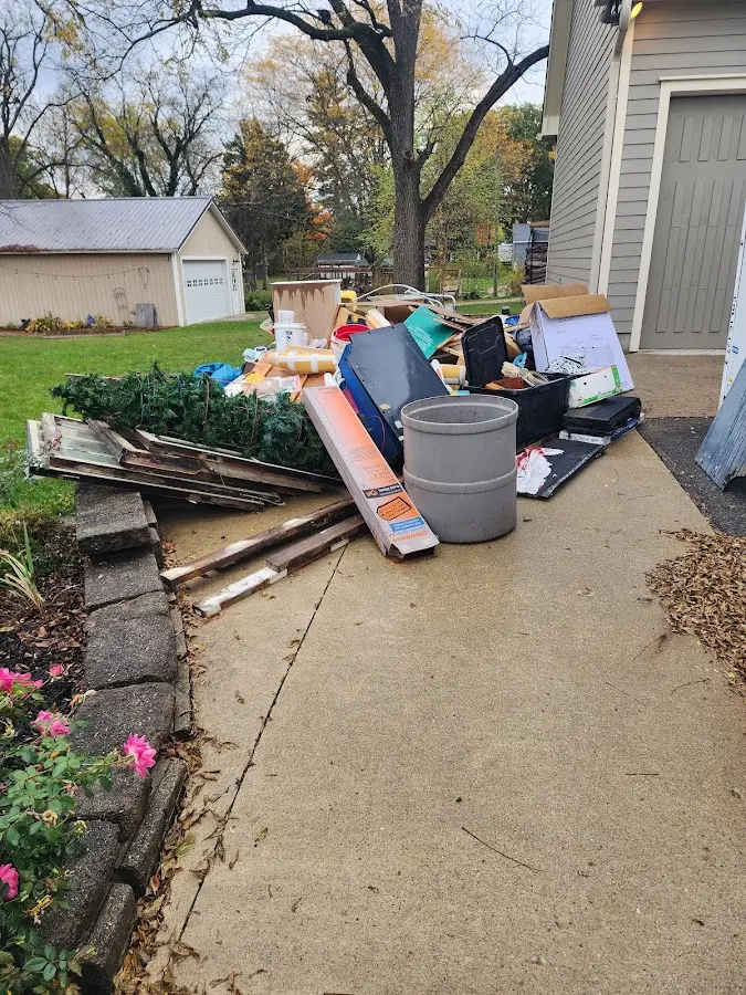 Dumpster being loaded with debris for 30 Yard Dumpster Rental in Elkton